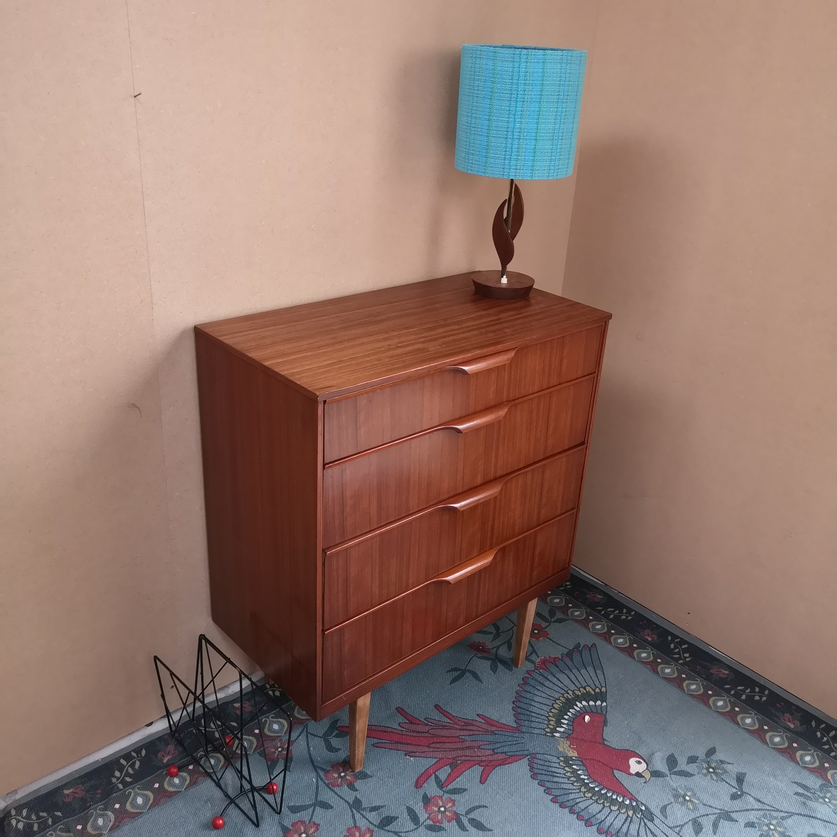 Teak chest of drawers on tapered legs
